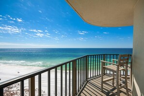 Balcony with chairs and a beautiful view of the gulf.