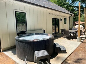 Relax in the hot tub on our back patio.