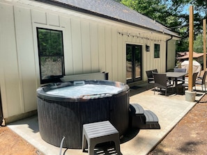 Relax in the hot tub on our back patio.