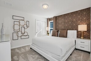 Splendid Bedroom of the Apartment in Davenport Florida - Modern bedroom with sleek design and ample natural light - Spacious bedroom offering comfort and style - Bright and airy bedroom with windows for natural illumination