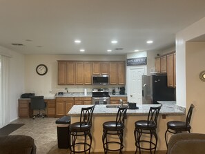 Kitchen with stainless steel appliances and new granite countertops 