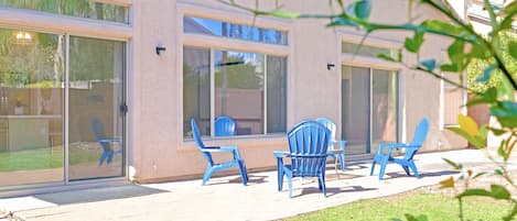 Backyard: Patio furniture surrounded by beautiful desert plants 