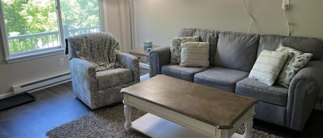 Spacious living room with large window! 