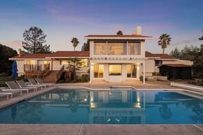 Saltwater pool that is gas heated all year, 8 pool loungers, fire pit with outdoor sectional couch, large view deck, and outdoor dining.