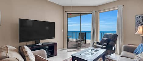 Living Room with Plenty of Comfortable Seating, Queen Size Sleeper Sofa, Flat Screen TV & DVD Player and Floor to Ceiling Views of the Gulf of Mexico