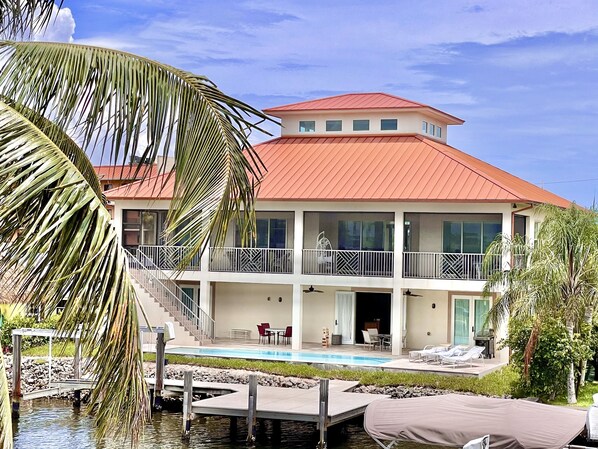 Beautiful spacious house screened upstairs lanai canal dock pool and bay view