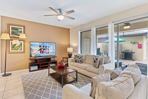 The living area, equipped with a smart TV, transforms into an entertainment oasis, where immersive experiences and cherished moments unfold in the comfort of home.