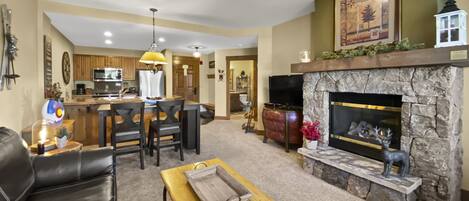 Mountain Thunder Lodge 1213 - a SkyRun Breckenridge Property - Living room with flat screen TV and gas fireplace!