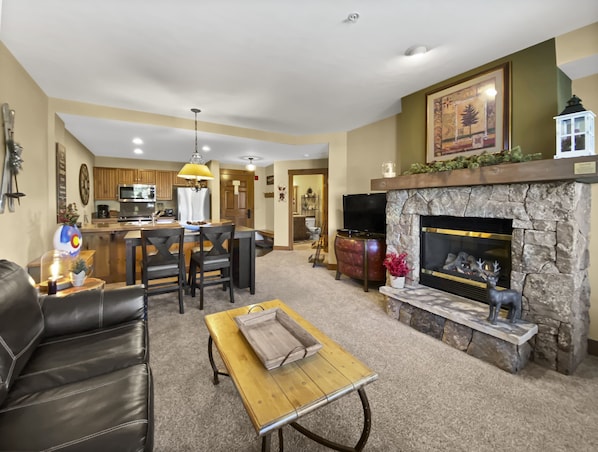 Mountain Thunder Lodge 1213 - a SkyRun Breckenridge Property - Living room with flat screen TV and gas fireplace!
