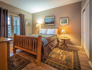 Log bed frame makes tops off this rustic condo