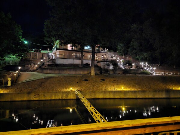 View of house from the dock. Property is well lit at night for safety.