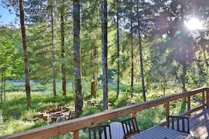 Relax on the deck looking out over the beautiful Sandy River.