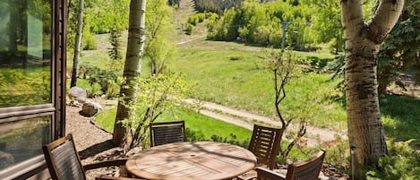 The patio is an ideal spot to soak up the spectacular views of Aspen Mountain on a sunny summer day.