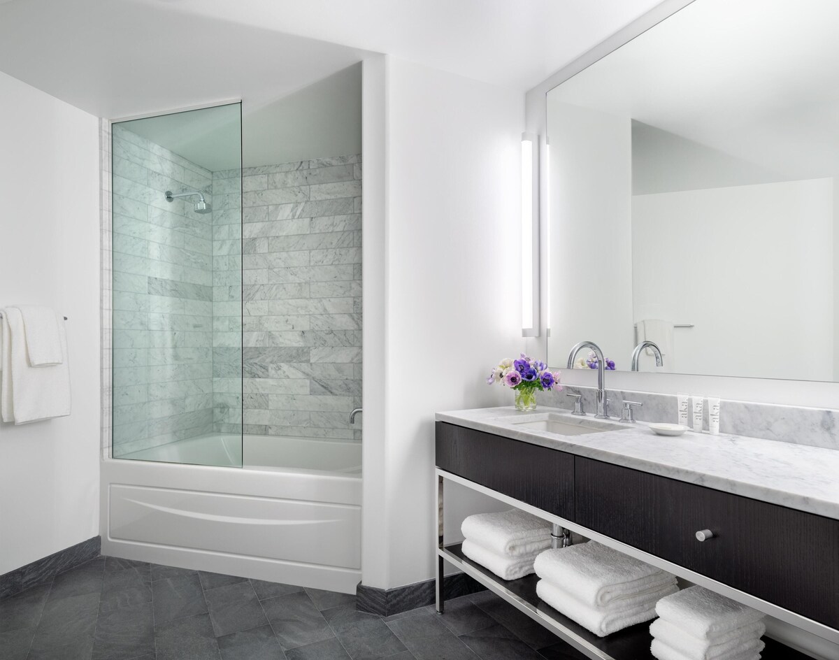 AKA Residences Sharply Appointed Suite w/ Kitchen, Den Space, Patio, & WiFi