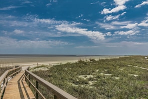This boardwalk is located right in front of our home and has no stairs. We offer a wagon to help with the convenience of getting your items down to the beach.