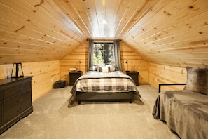 Queen bedroom with a great view out onto the trees. 