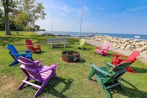 Tons of Adirondack and patio chairs by the lake!