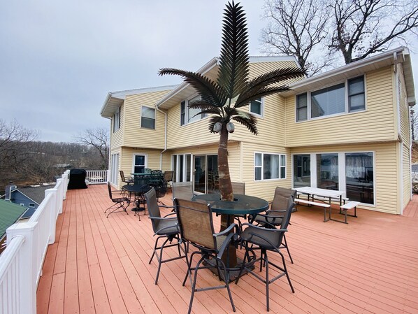 Expansive deck with seating, a grill and million dollar views.
