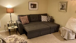 Sofa bed expands to sleep 2 (queen size).  Linens located in the chaise storage.