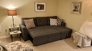 Sofa bed expands to sleep 2 (queen size).  Linens located in the chaise storage.