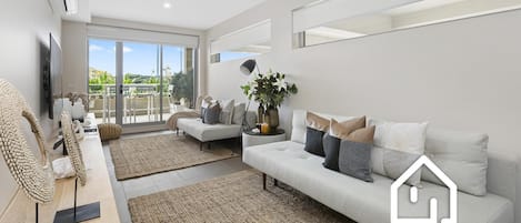 Comfortable couches and a smart TV, leading to private alfresco