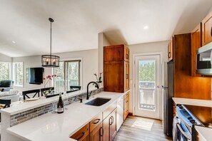 Brand new, well stocked kitchen has all the amenities of home
