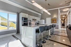 Kitchen area with bar stools