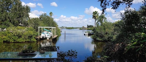 View from back yard area which you have access. No direct water view from apt.