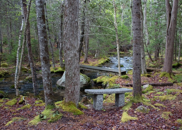 Granite bench by the stream