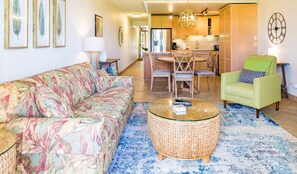 Bright and spacious living area with queen-sized pull-out sofa bed.