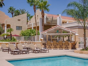Large heated swimming pool, poolside loungers and picnic tables