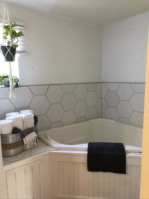 Mineral soaking tub in the Master suite, part of the five piece bathroom set.