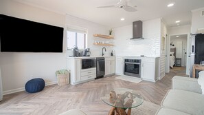 A wider view of the kitchen, yes - the fridge w/ ice maker is on the right.