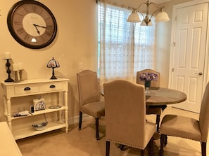 Dining seating for 4. Door leads to walk-in pantry.