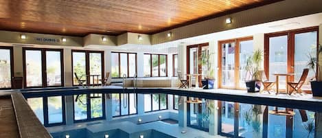 Indoor pool with spa and sauna