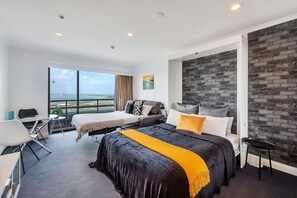 There is a queen bed and a pull out sofa bed in the living space.