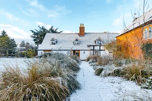 main house back and hay barn