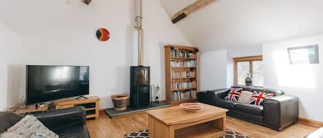 hay barn upstairs kitchen dining living open plan area with woodburning stove