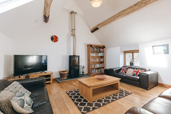 hay barn upstairs kitchen dining living open plan area with woodburning stove
