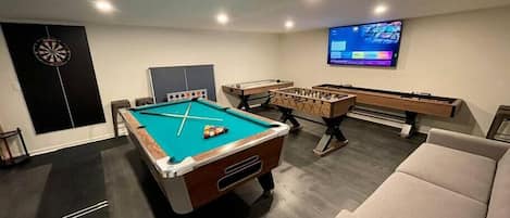 Game room! Complete with pool table, darts, foosball, air hockey and shuffle board.