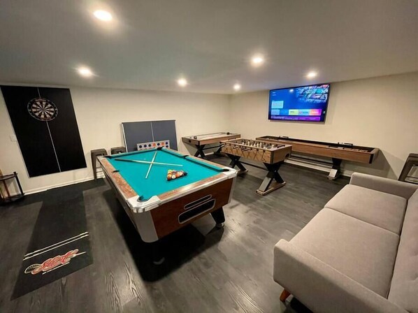 Game room! Complete with pool table, darts, foosball, air hockey and shuffle board.