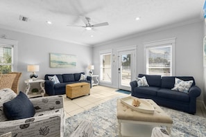 Living room has ample seating plus a sleeper sofa.