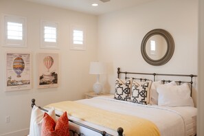 Master bedroom downstairs - Relax in a serene master bedroom with king-size bed and soft, neutral tones.