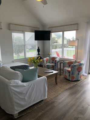 Light bright living room with plenty of room for your family and friends