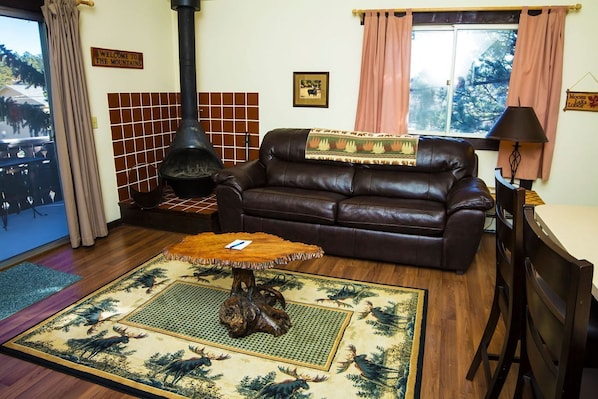 Living Room with Free Standing Wood Burning Fireplace