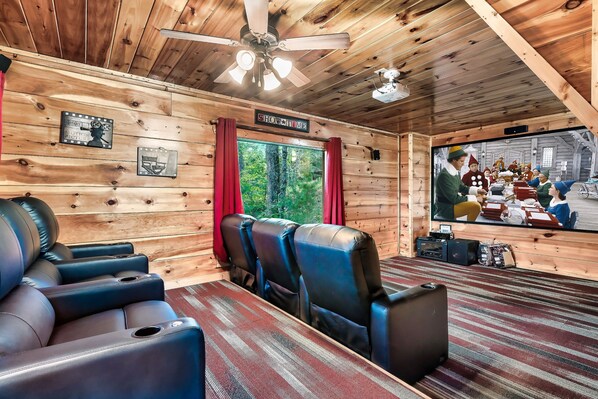 The media room boasts a 120 inch HD screen and projector. Streaming available.