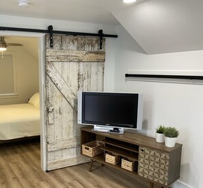 Barn door between living and bedroom