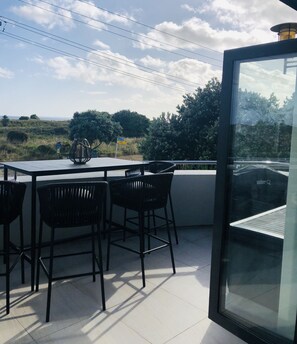 deck off living area, with weber bbq