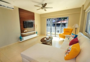 Living Room:
50" flat-screen TV, balcony
