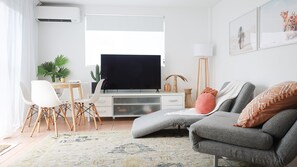 Living space, with sofa option.
Smart TV and free wifi included and AIRCON
